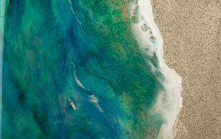 original-resin-seascape-artwork-with-green-wave-with-lady-surfer-on-mable-like-texture